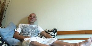 Stud jerking cock on his bed before cumming