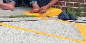 Homeless girl picking toe jam from her feet foot fetish