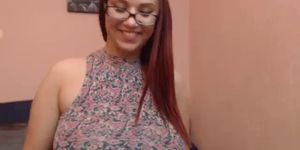 Busty natural redhead reveals her huge tits and ass - video 1