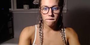 blonde blue eyed girl with glasses brackets and pigtails
