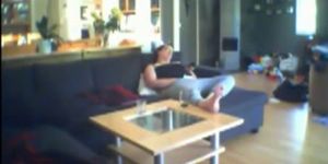 Voyeuring milf Jenny fingering on the sofa