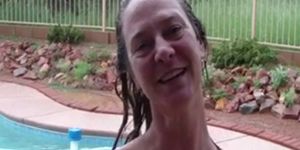 Wife having sex with husband by swimming pool