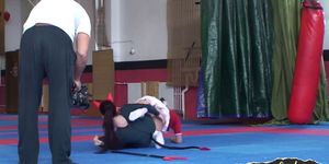 Sapphic cheerleader wrestling on the floor