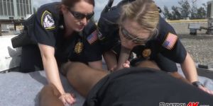 Putting hard a big black cock is a duty that only the two horny cops know how to do it better