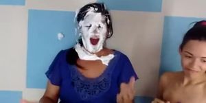 Woman gets her head stuck in a cardboard box and then pied in the face