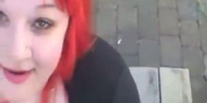 Big slut with red hair, sucking on the street