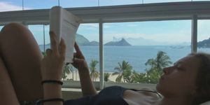 Beautiful Girl Fills Her Mouth In Paradise After Reading