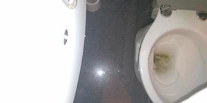 hidden camera at a Chinese restaurant, he pisses all over the toilet.