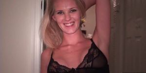 Cute blonde in lingerie gently massages herself