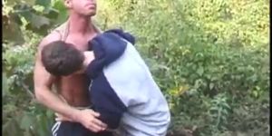 Bodybuilder Bo Knight gets fucked by young Aaron Cummings outdoors.