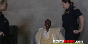 Stylish Black pimp takes two busty white milfs in cop uniform on amateur reality show