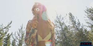 Blonde MILF hottie Elyse Jean stripteasing outdoor