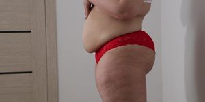 BBW shakes stuffed belly and fat ass in panties. Fetish.