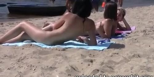 Shy girl pops her top off for all the beach goers