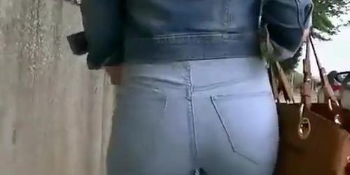 Girl in tight jeans pants and jacket