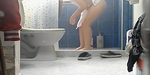 Chick with thick thighs and small boobs spied in bathroom