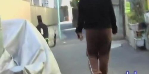 Asian girl in brown sweatpants gets a street sharking.