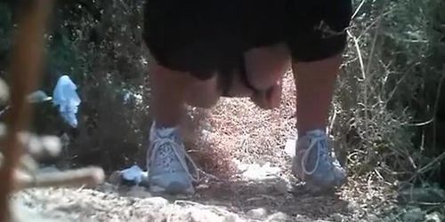 Sports chick pissing in nature