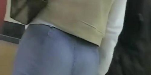 Non-nude street voyeur video of a terrific ass going shopping