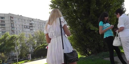 Sexy blonde in white dress lures up skirt camera