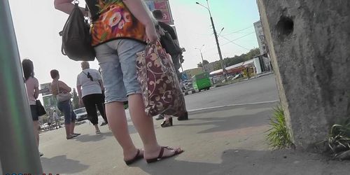 Blonde MILF caught on the upskirt camera in the bus