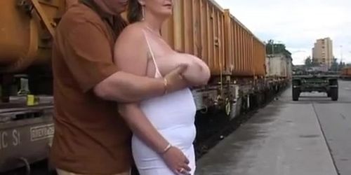 He plays with her by the railway