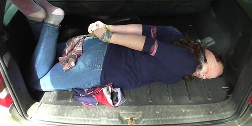 Hogtied and blindfolded in car