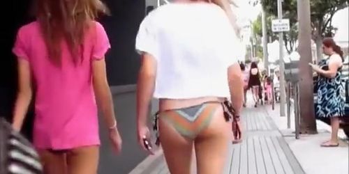 Lovely bikini girls walking down the street