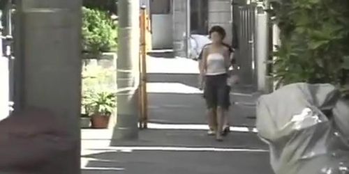 In this asian sharking video a guy pulls of the shirt of a sexy woman