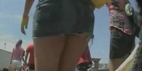 An upskirt spy cam shot of an arousing butt