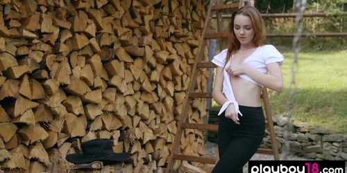 Skinny redhead russian babe Kate Great stripping and chopping the firewood