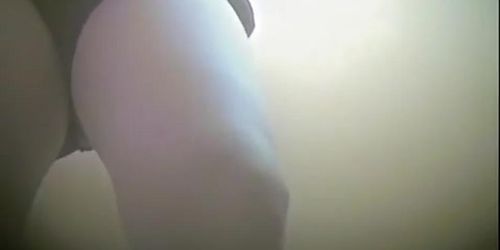 Woman uncovering her nub slit on hidden cam in change room