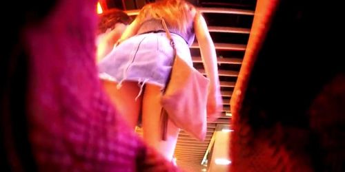 Upskirt inside a jeans miniskirt while walking