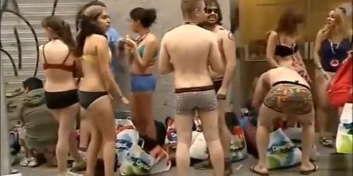 Spain students wearing only underwear wait in front of the shop for it to open