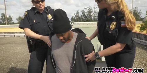 Criminal gets his dick serviced by horny milf cops on rooftop