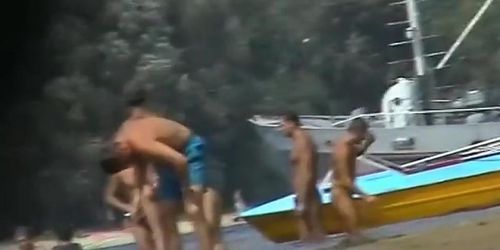 Hot beach voyeur video shows mature nudists enjoying each others company.