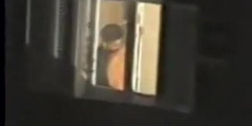 Man kissing the naked lover on window voyeur movie