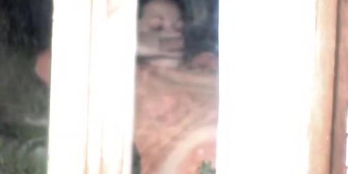 Female spied masturbating through the window of her bedroom