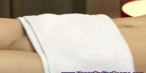 Masseur uses feet on model during her massage session