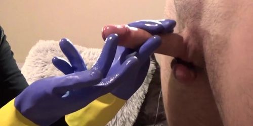 Amateur with rubber gloves stroking a hard dick