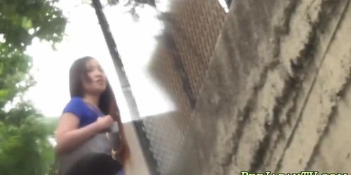 Cute asian teen pissing outdoors