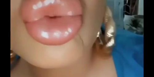 Big fake bimbo lips kissing