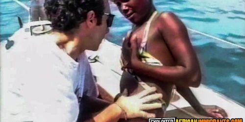 EXPLOITED AFRICAN IMMIGRANTS - Black Bikini Babe Public Interracial Banging On A Boat And Beach