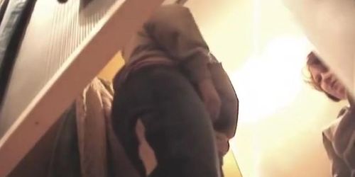 Woman in tan pantyhose sexy bent over in changing room