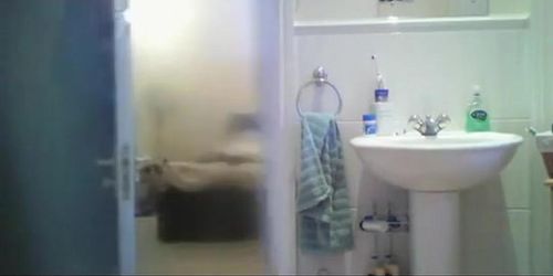 Hidden camera in bathroom catches busty chick