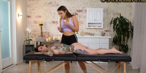 Lesbian masseuse licking tattooed dyke during massage