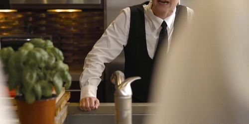 Two caterers caressing each other just out of view of their boss (Khloe Kay, Mary Jane Wilde, Jane Wilde)