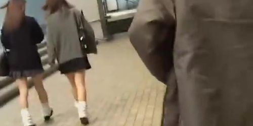 Japanese schoolgirls in a kinky street sharking video