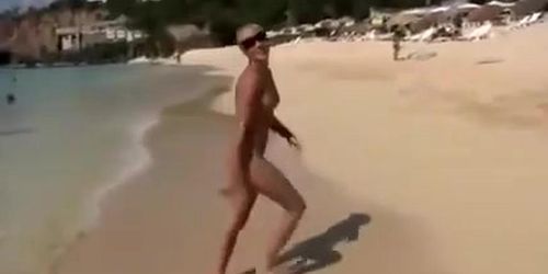 Naked models have fun on a beach vacation