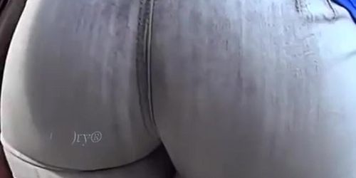 Big round ass woman in tight jeans pants